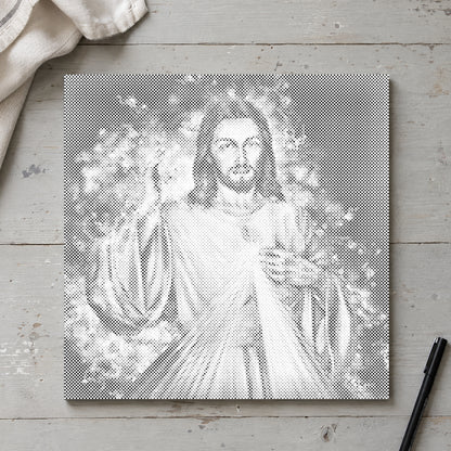 Prikmaleriet “Jesus: Fortsættelsen”, set ovenfra på et arbejdsbord i blødt dagslys.