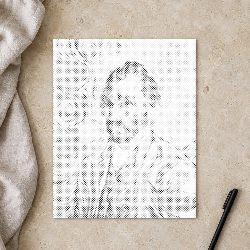 Prikmaleriet “Vincent van Gogh selvportræt”, set ovenfra på et arbejdsbord i blødt dagslys.